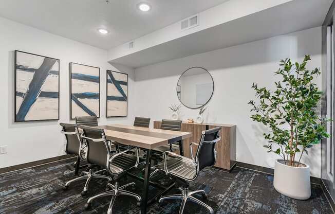 a conference room with a table and chairs