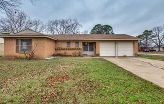 Three bedroom, 1.5 bathrooms, and a two car garage.