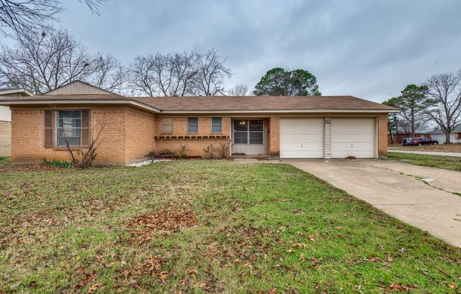 Three bedroom, 1.5 bathrooms, and a two car garage.