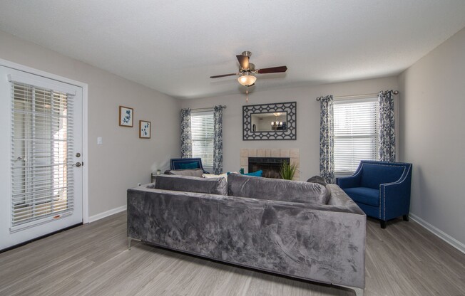 Living room with hardwood floor and natural light at St. Croix Apartments in Virginia Beach VA