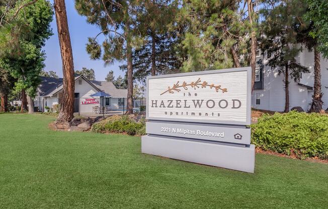 a large lawn in front of a sign