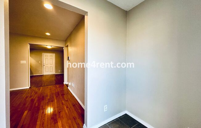 Adorable Home Featuring Wood Floors, SS Appliances, Updated Bathrooms and Plenty of Natural Light!