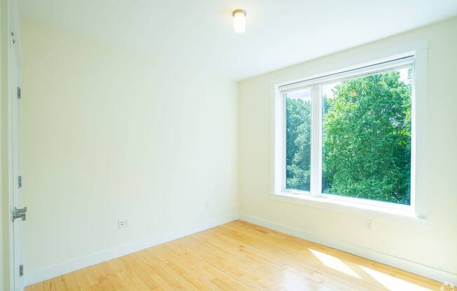 A room with a window and wooden flooring at 603 Concord Apartments, Cambridge, MA, 02138