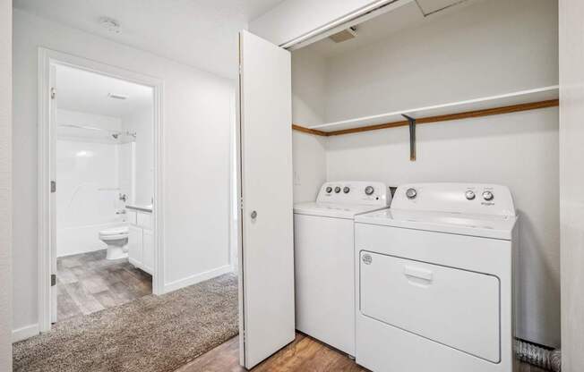 A laundry room with a washer and dryer.