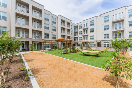 Lush Green Courtyard Wit Walking Paths at Residences at 3000 Bardin Road, Grand Prairie, TX, 75052