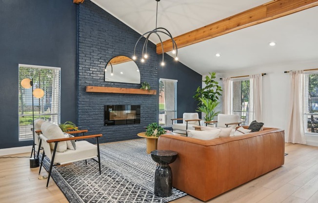 A living room with a fireplace and a large couch.