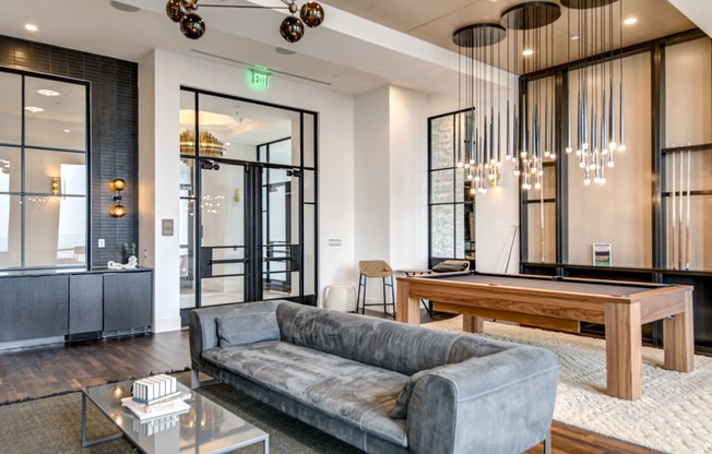 a room with a pool table and a couch