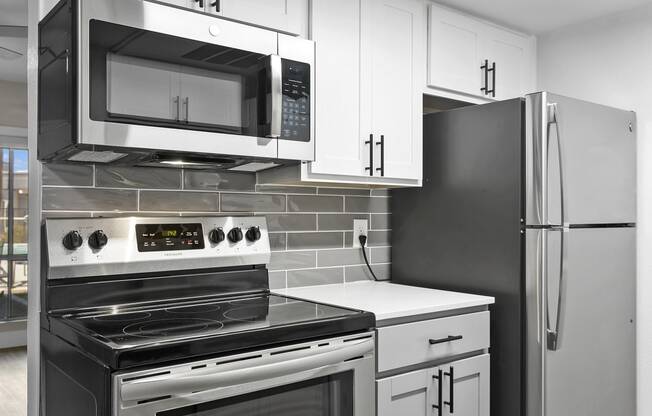 SITE Scottsdale Apartments Renovated kitchen with stainless steel appliances