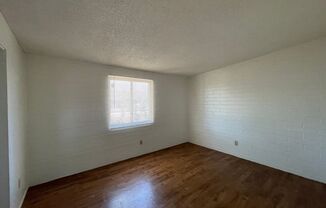Central 2 bedroom 1 bath unit with Fenced yard.