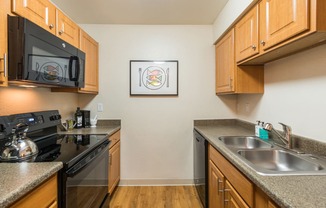 Kitchen at Apres Apartments in Aurora, CO