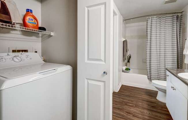 Full sized washer and dryer with hard surface flooring, Plaza Museum District