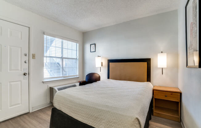 a bedroom with a bed and a window  at Waterford Studios, Austin