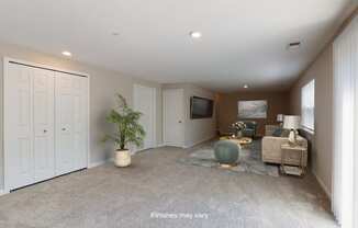 a living room with a couch and a tv