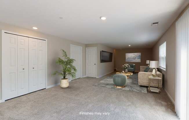 a living room with a couch and a tv