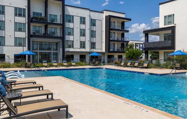 Rhythm Resort-Style Pool with Chaise Lounge Seating and Sundeck