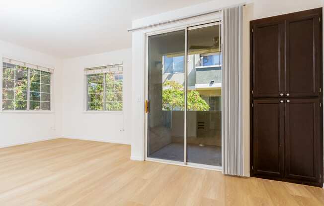 a living room with a sliding glass door to a bathroom