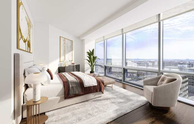 a bedroom with a bed and a chair in a 555 waverly unit