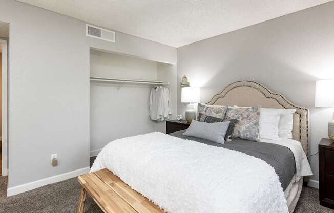 A picture of a bedroom and closet in an apartment