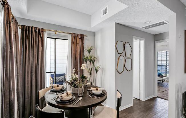 an open living room and dining room with a table and chairs