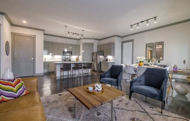 spacious, open-concept kitchen and living room at Reveal Skyline apartments