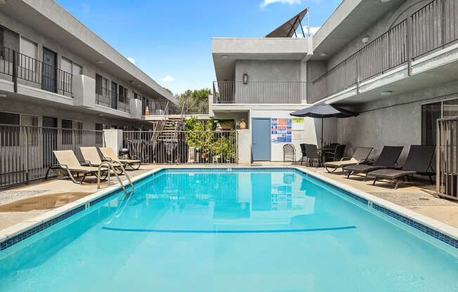 One of two large gated pools and lounging area.