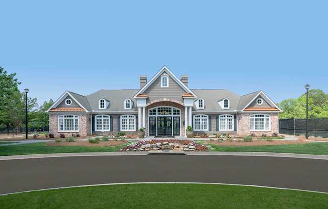 A large, well-maintained house with a landscaped front yard.