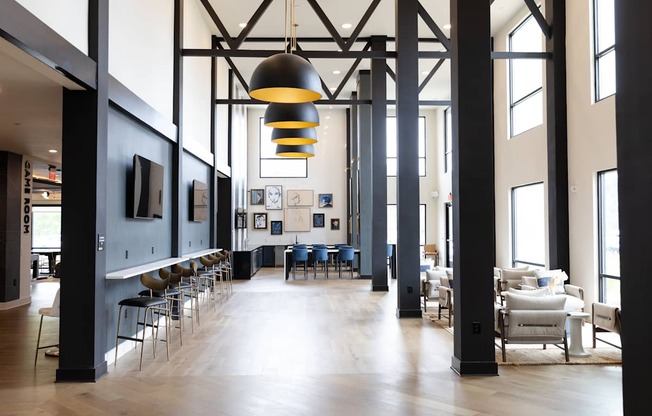 A large room with a long table and chairs.