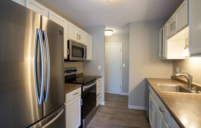 Get $500 OFF! Fabulous Totally Renovated 3 Bedroom with W/D, A/C, D/W, Parking, Etc!!