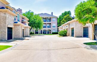 Direct access garages at Bentley Place at Willow Bend Apartments in West Plano, TX, For Rent. Now leasing 1, 2, and 3 bedroom apartments.