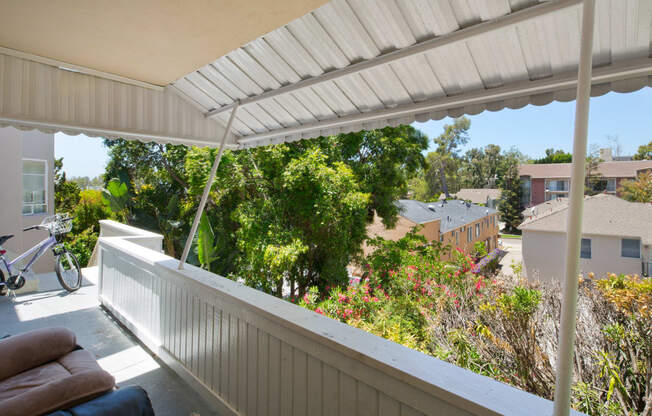 Apartment building balcony area with outdoor furniture