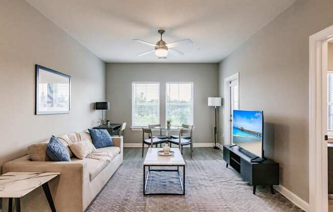 a living room with a couch and a tv