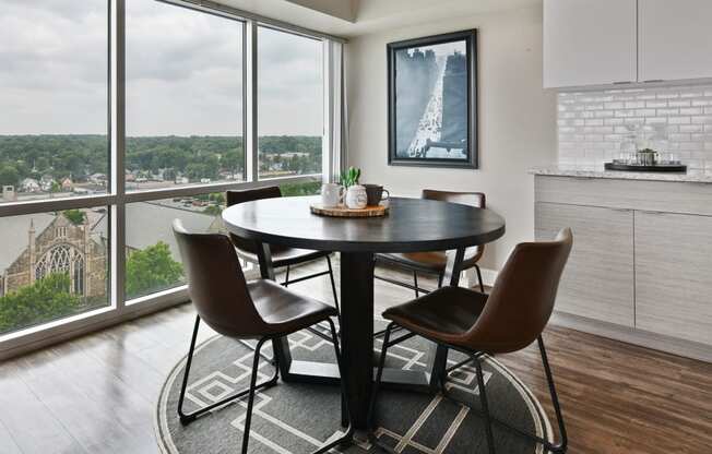 Cozy dining room with large windows and view of the city at CityView on Meridian, Indianapolis, IN,46208