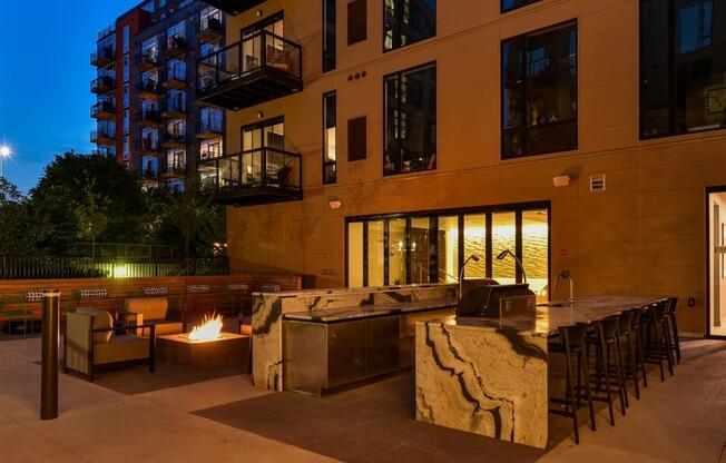 outdoor kitchen with grills and night