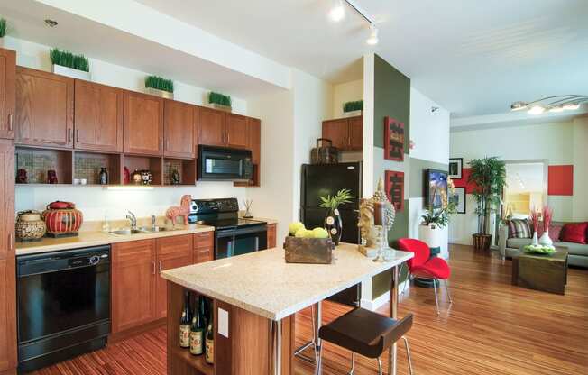 a kitchen and living room with a marble counter top