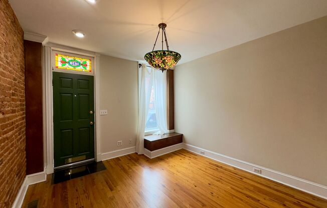 Charming 2 Bedroom/1 Bathroom Townhome with Deck and Parking Pad in South Baltimore!
