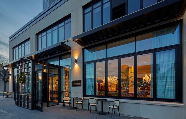 A modern building with a glass entrance and a balcony.