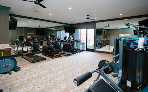 a room filled with lots of different types of exercise equipment at Fairfax, Grandview, Ohio