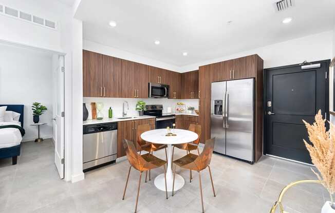 a kitchen and dining area in a 555 waverly unit