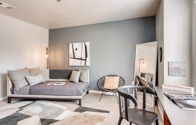 A fully furnished bedroom at Eagles Landing at Church Ranch Apartments