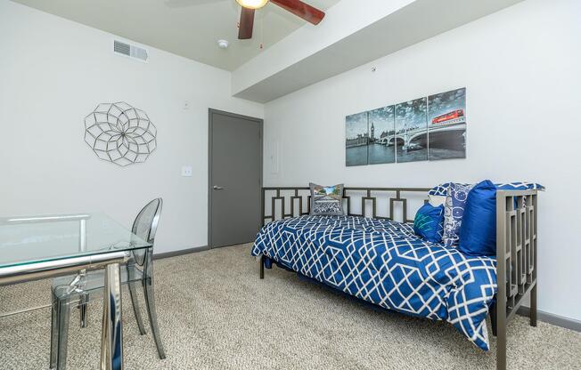 a room filled with furniture and a blue chair