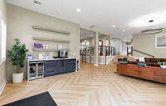 A well-lit, spacious interior with wooden flooring and a variety of furniture and decor.