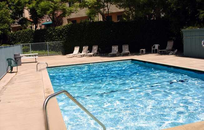 Beautiful community pool with lounging area.