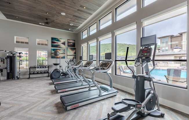Fitness Center With Treadmills, Elliptical Machines, And Weight Rack