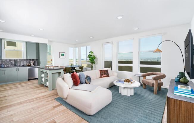 Open-concept floor plans pair expansive living areas with oversized windows, abundant natural light, and seamless kitchen integration.