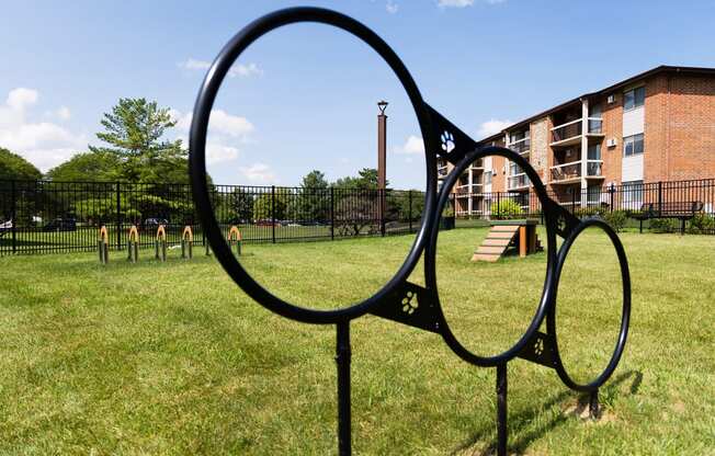 a large magnifying glass sign in the middle of a park