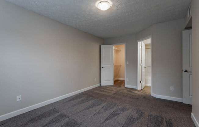 Bedroom with window and wooden floor with ceiling light at Bayside Apartment Homes, Hilliard, 43026