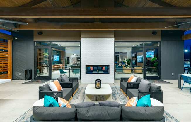 a living room with couches and a coffee table and a fireplace