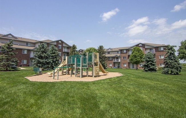 Playground and grass at Northridge Heights apartments in Lincoln