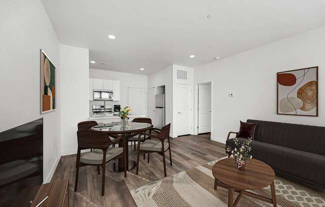 A modern living room with a dining table and chairs.