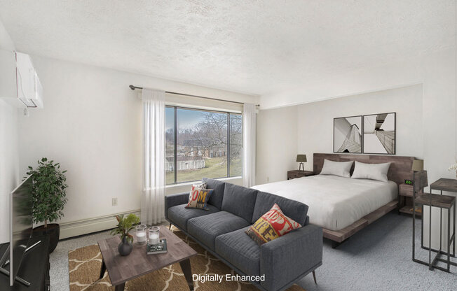 studio living areas with large window at Seville Apartments in Kalamazoo, MI 49009